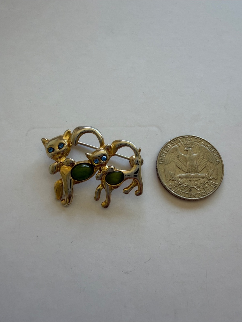 Vintage Cat Brooch with Green Cabochons and Blue Eyes